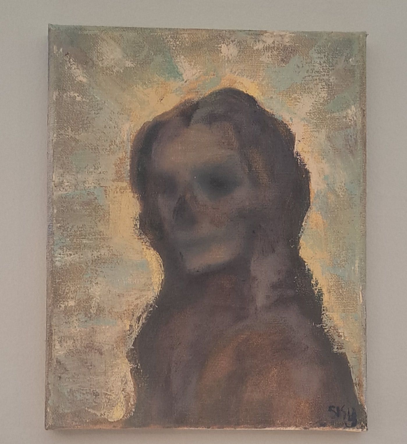 Portrait of a person with long hair, painted in muted brown and blue tones, set against a pale, textured background.