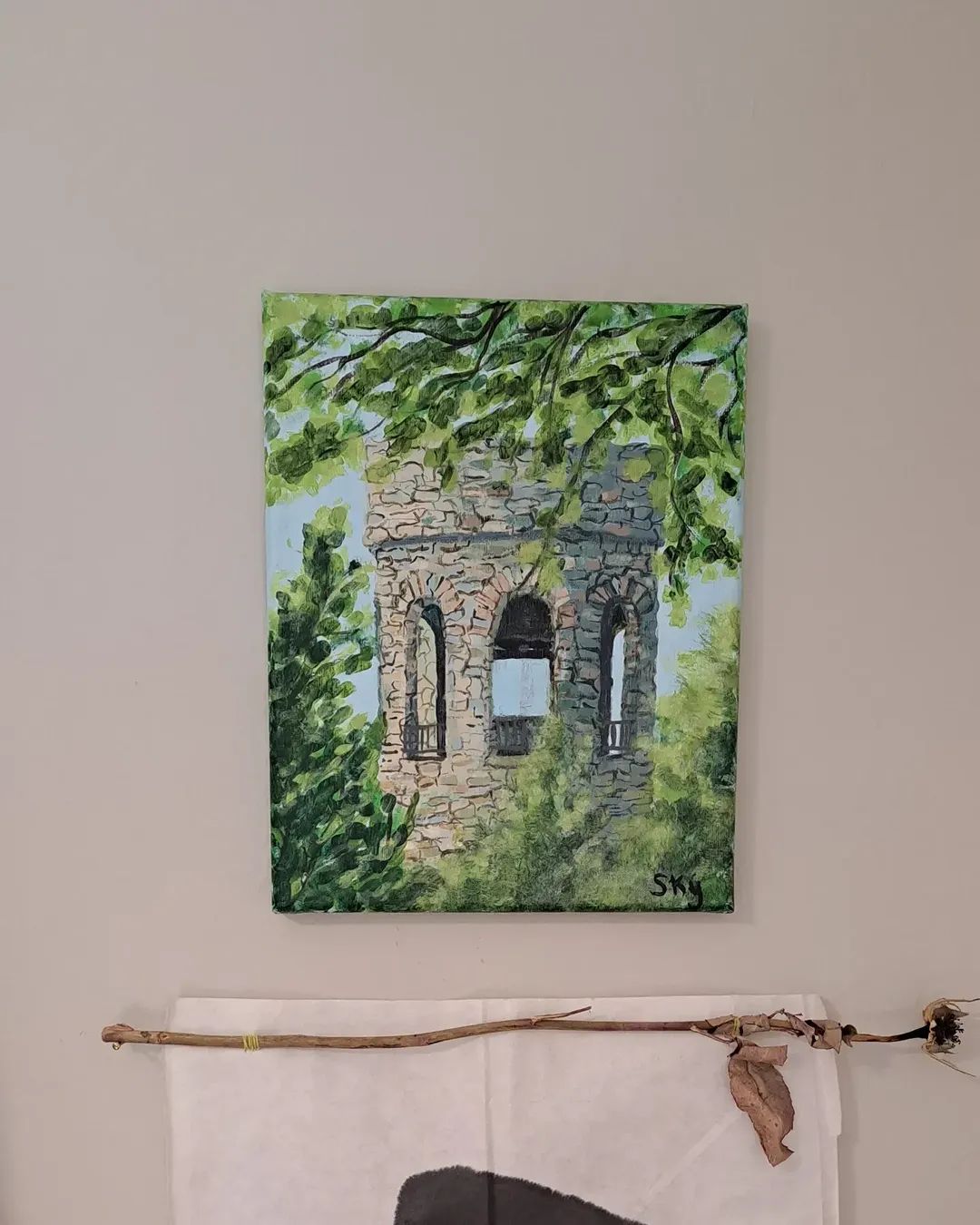 Painting of a stone tower obscured by green foliage against a blue sky.