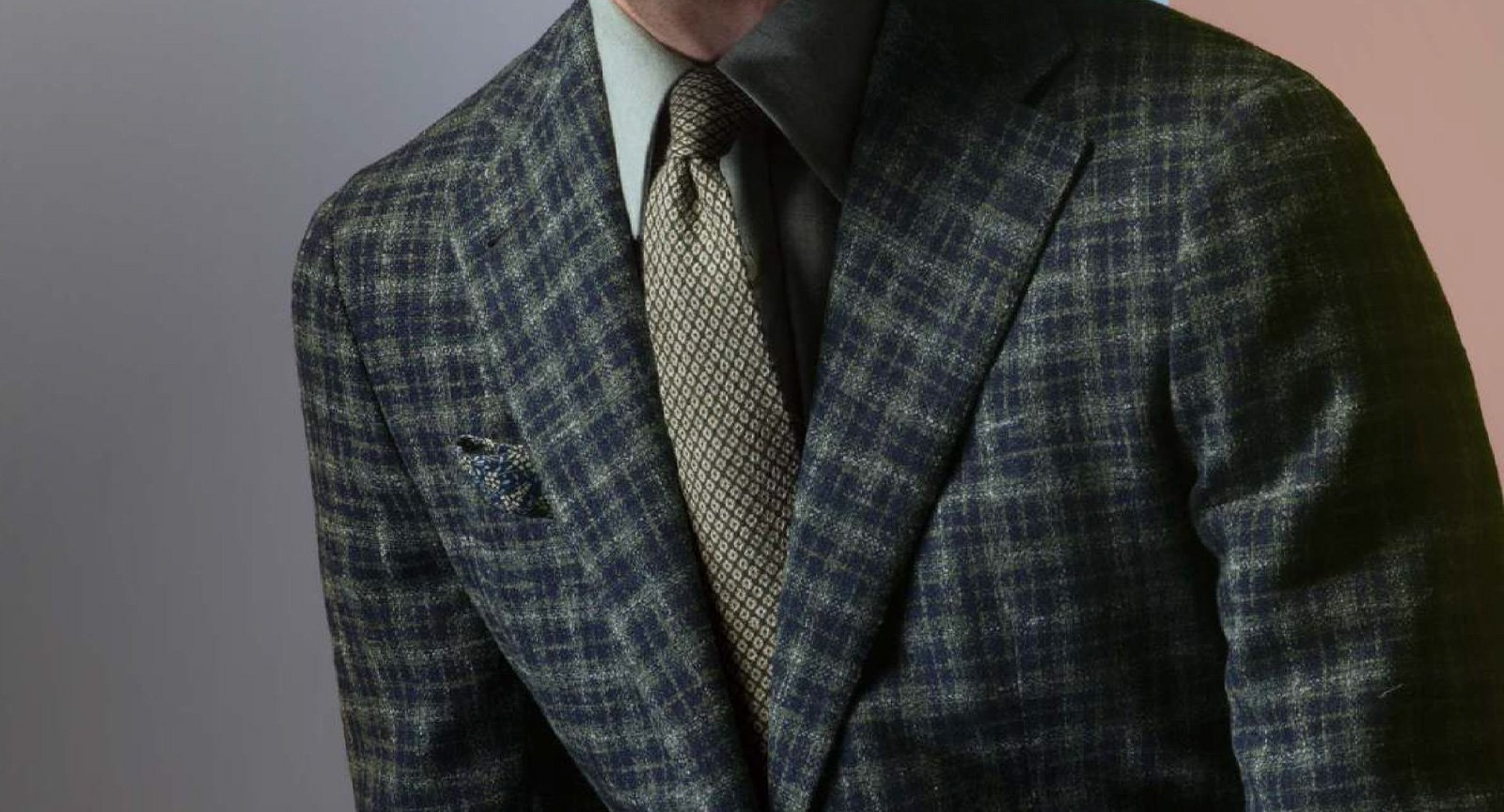 A man is wearing a suit and tie.