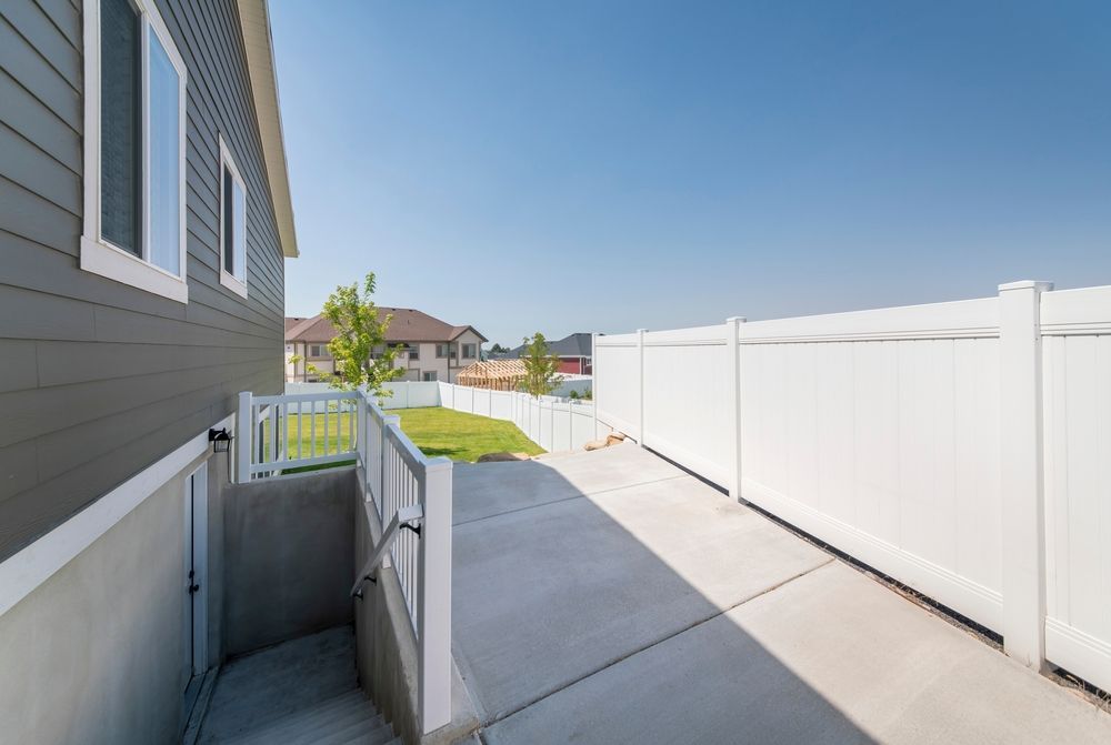 There is a ramp leading to the backyard of a house.