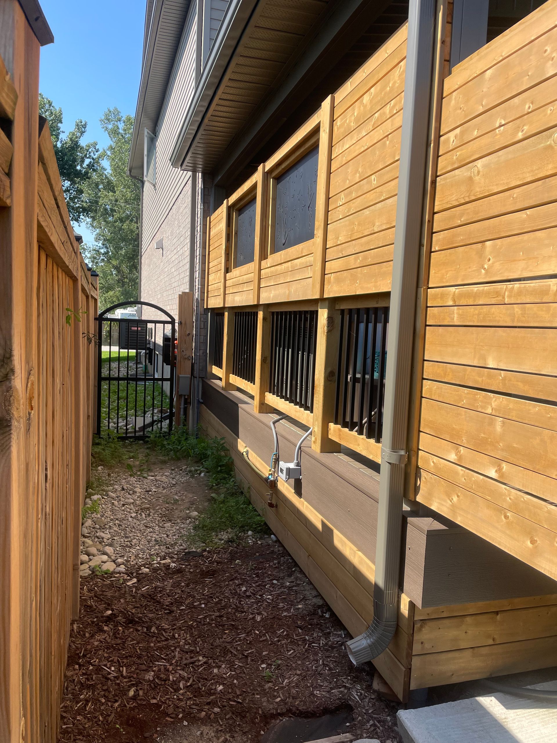 newly installed wooden fence and patio railings