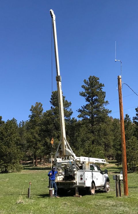 Water Well Testing - Pump hoist raised to pull a well pump in Weston, CO