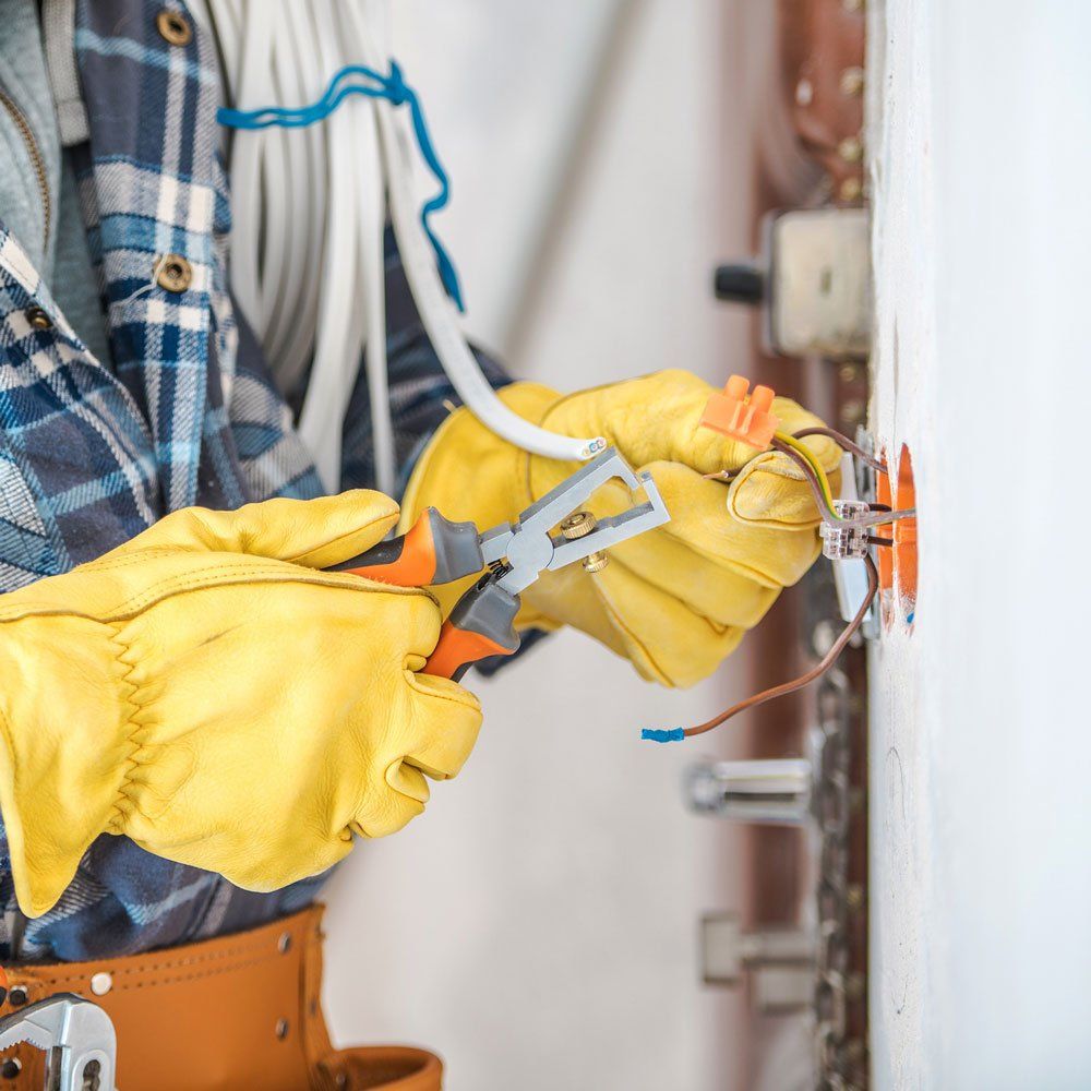 Electrician Fixing Wires — Geneva, OH — American Electric LLC