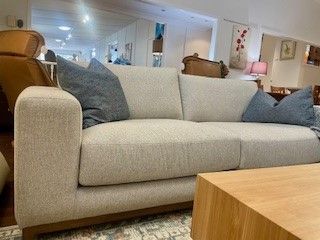 Beige Sofa With Blue Pillows — Hastings Specialty Furniture In Port Macquarie, NSW