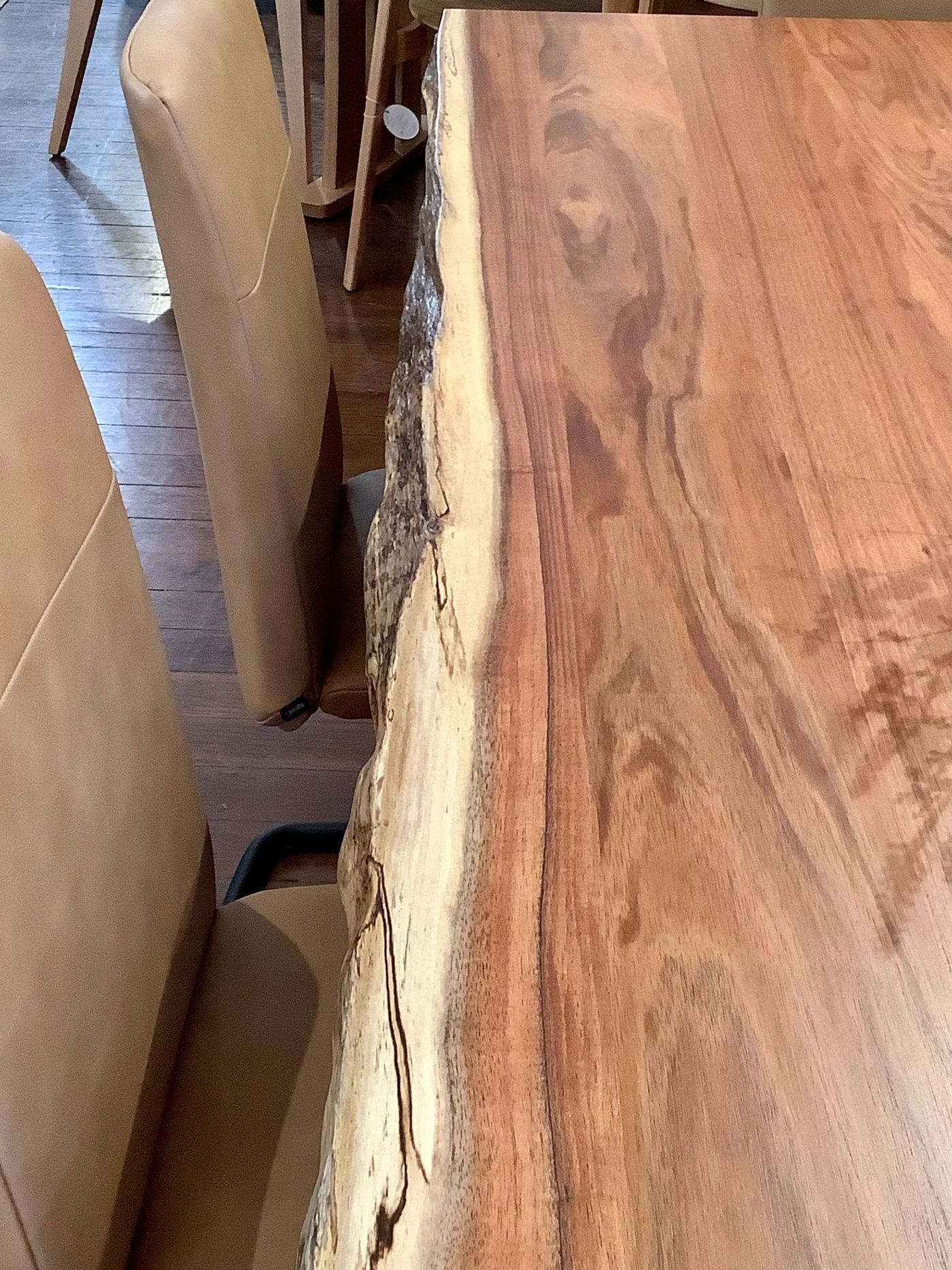 Close-up of a Wooden Dining Table With a Natural Edge — Hastings Specialty Furniture In Port Macquarie, NSW