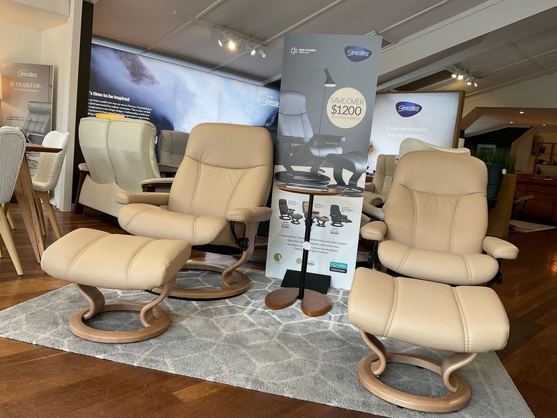 Two Light Tan Leather Recliners and Footstools — Hastings Specialty Furniture In Port Macquarie, NSW