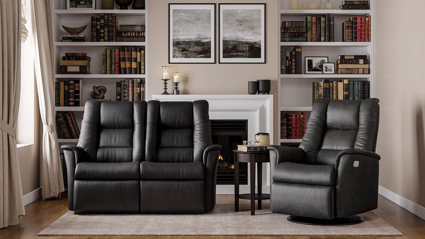 Black Leather Sofa and Recliner — Hastings Specialty Furniture In Port Macquarie, NSW