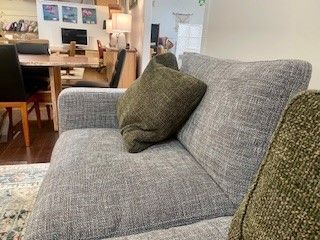 Grey Sofa With Olive-green Pillows in a Living Room — Hastings Specialty Furniture In Port Macquarie, NSW
