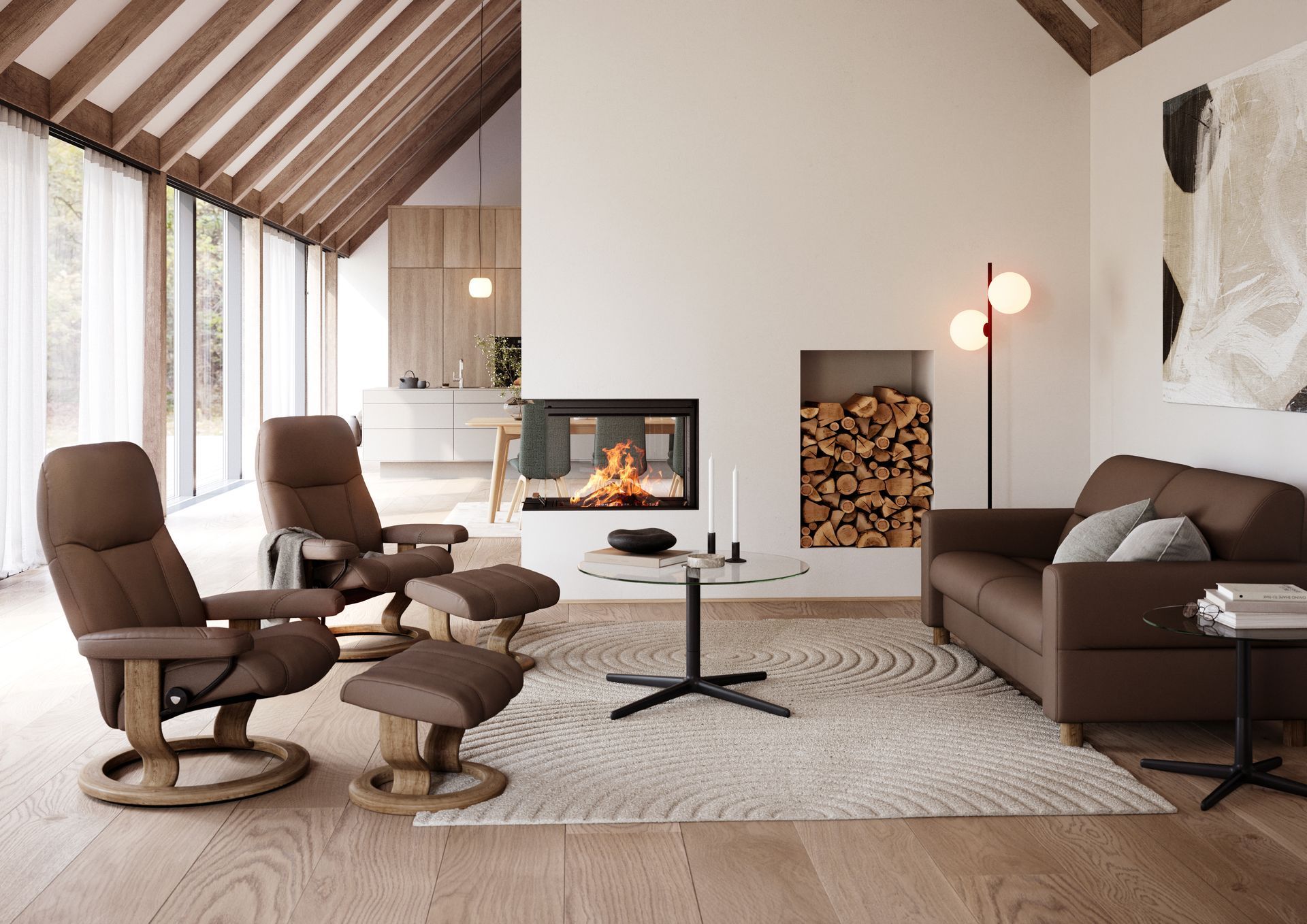 Modern living room with a fireplace, a brown sofa, and two matching reclining armchairs with footstools on a rug.