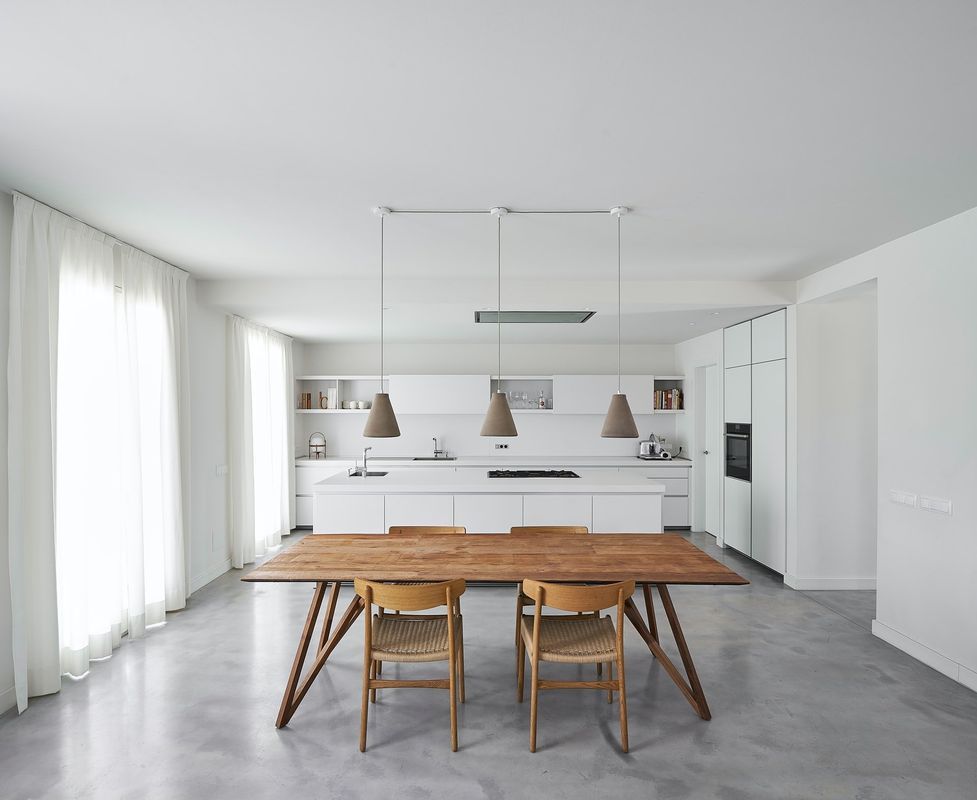 White Kitchen With a Wooden Dining Table and Chairs — Hastings Specialty Furniture In Port Macquarie, NSW