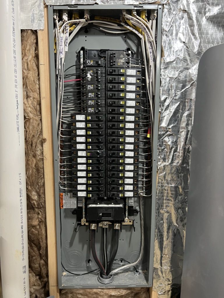 A close up of a electrical panel on a wall.