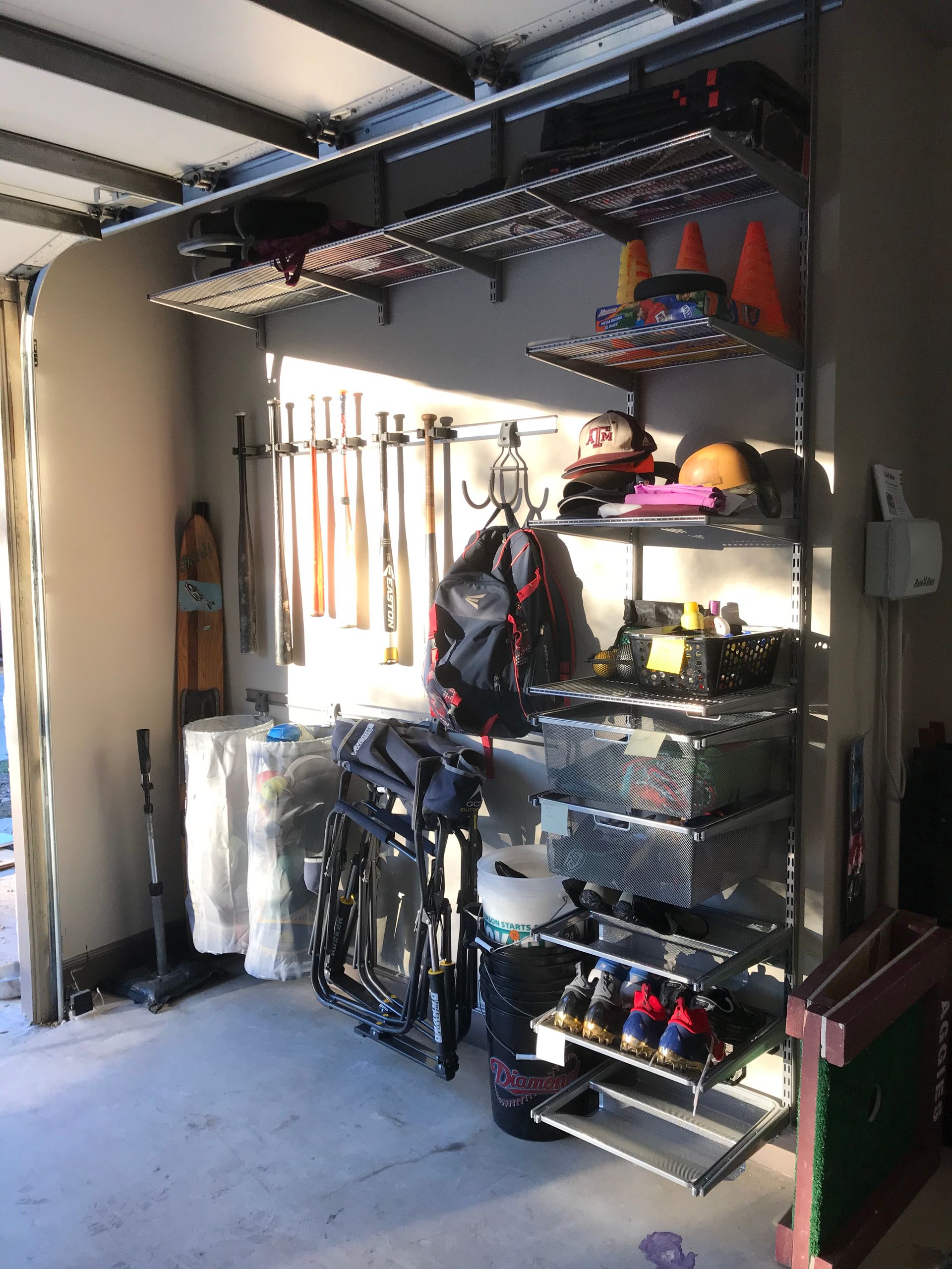 A garage filled with lots of shelves and a bicycle