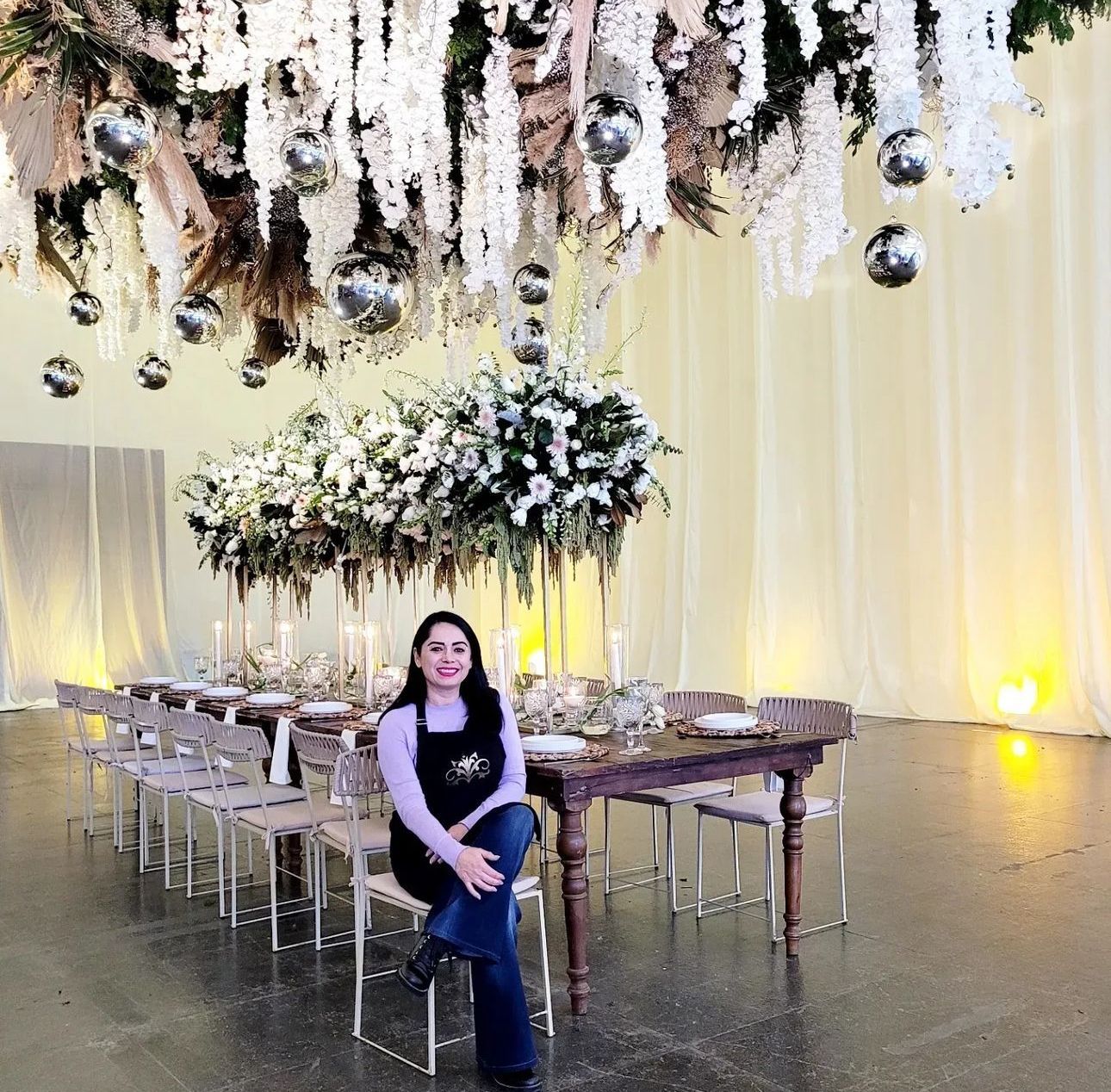 Image of CEO with an arranged table and flowers
