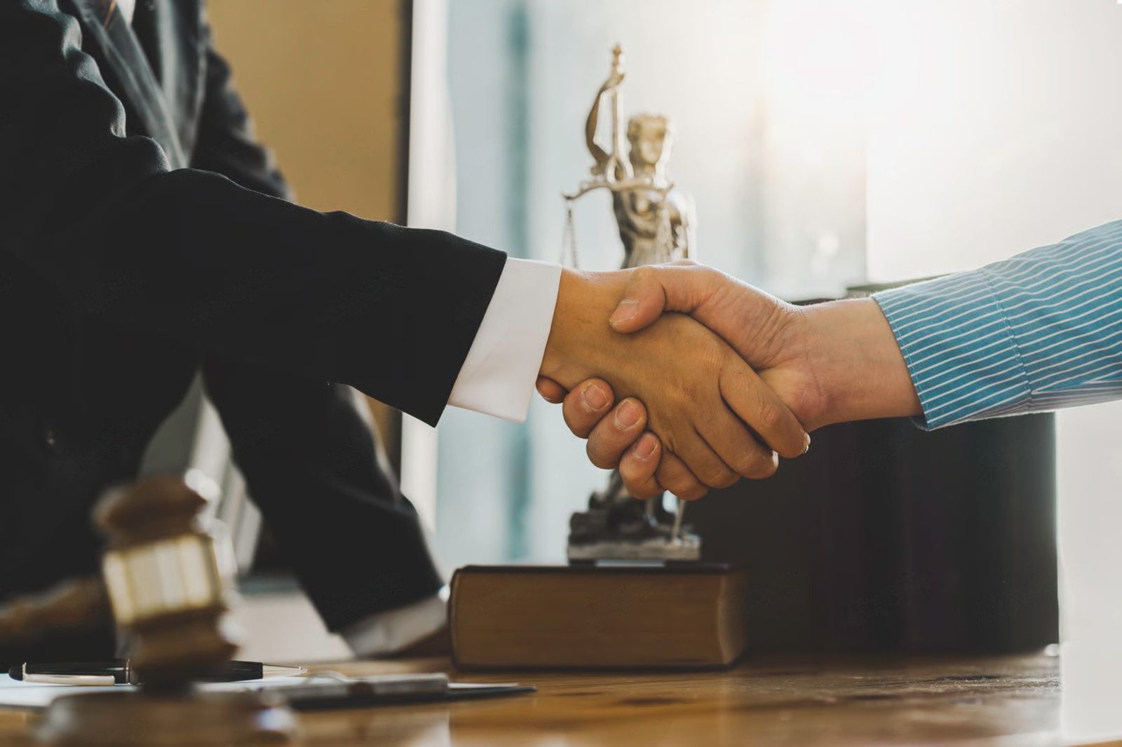 Family loading luggage into a car trunk; smiling people gather outdoors. 
