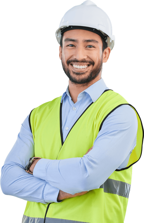 A man wearing a hard hat and safety vest is smiling with his arms crossed