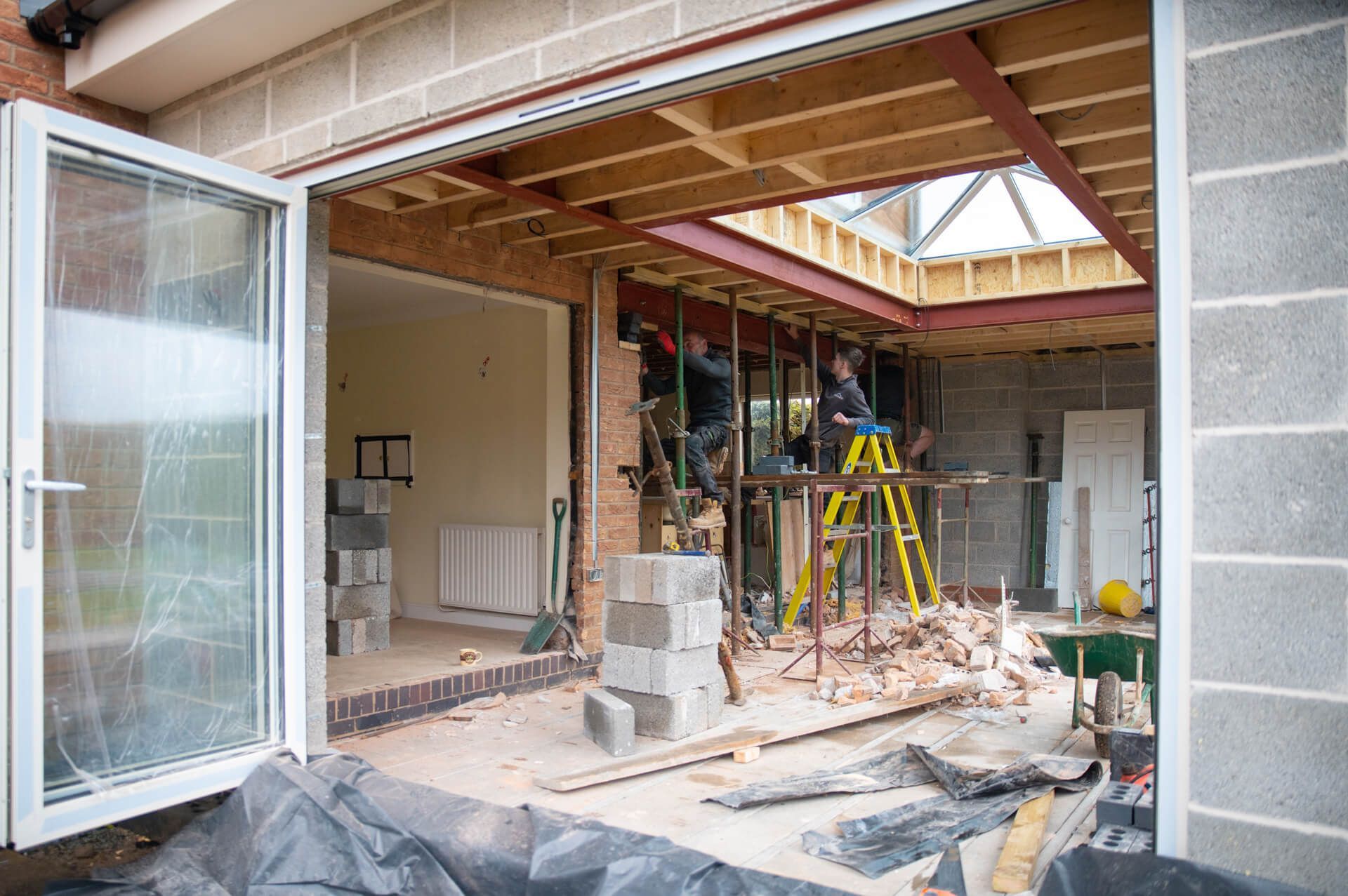 A house is being remodeled with a sliding glass door