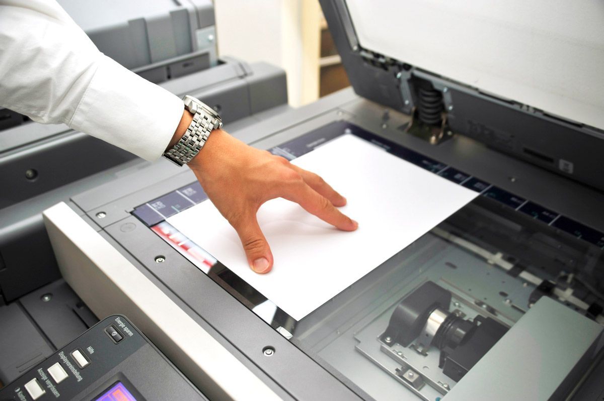 Man Hand Using Copier — El Paso, TX — One Stop Print Shop