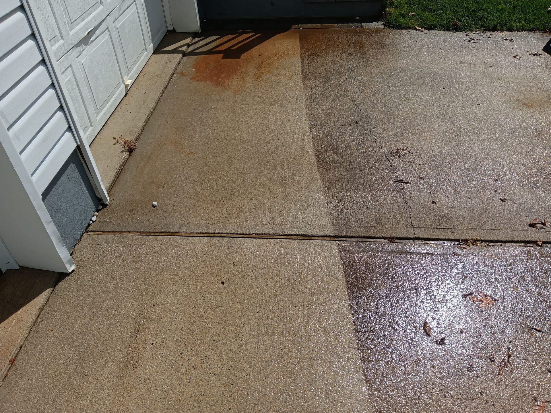 A before and after picture of a concrete driveway.