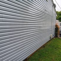 A large gray siding on the side of a house.