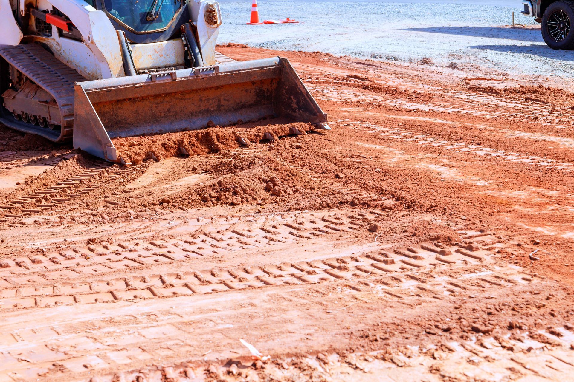 Two yellow excavators at a construction site, operated by excavation equipment contractors.