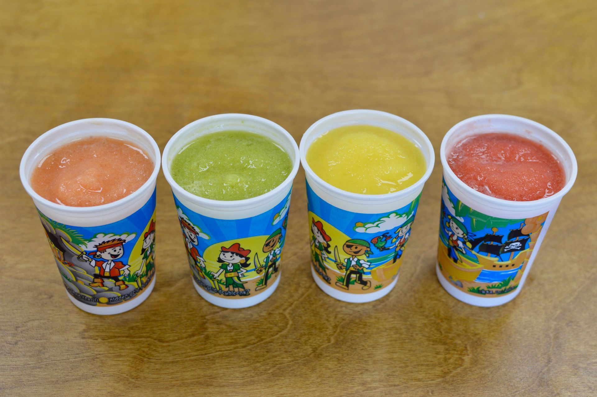 A glass of fresh orange juice with a splash, surrounded by oranges, with the words 