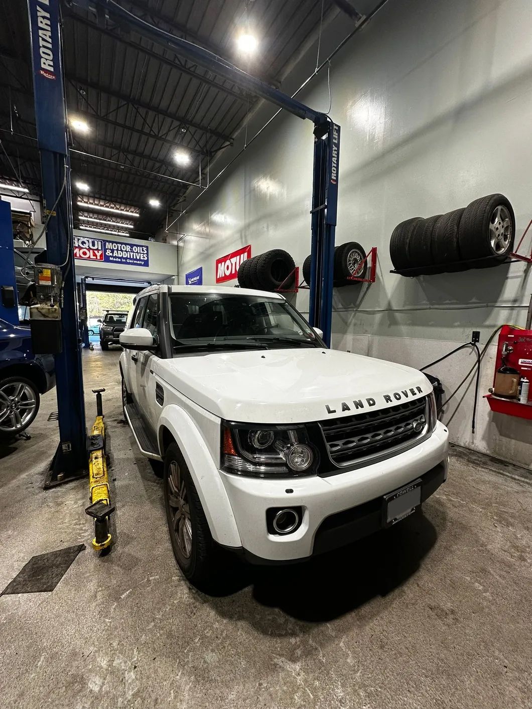 White Land Rover Vehicle in Garage | Bruno Automotive