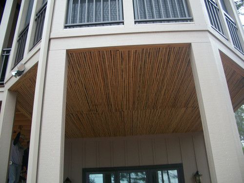 A house with a balcony and a wooden ceiling