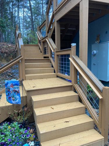 A wooden deck with stairs leading up to it.