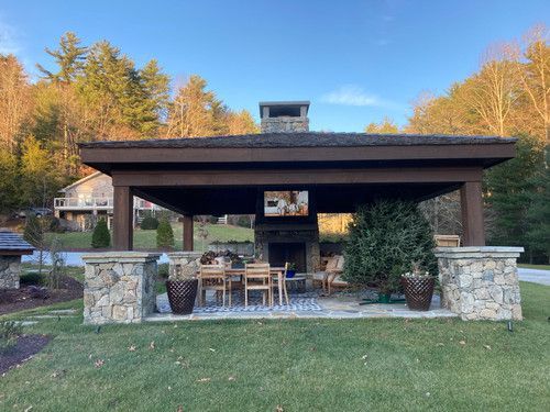 There is a pavilion with a fireplace and a television on the roof.