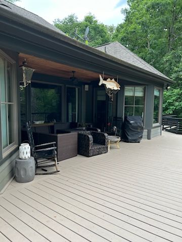 There is a large deck with a fish hanging from the ceiling.