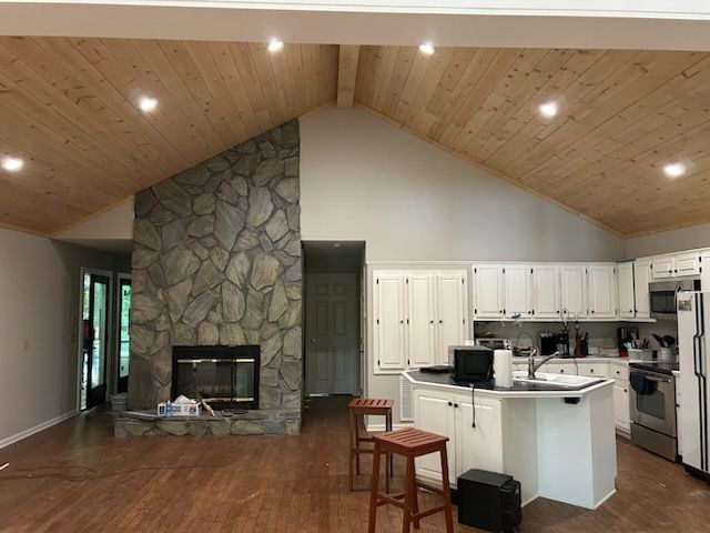 There is a grill on the porch of a house.