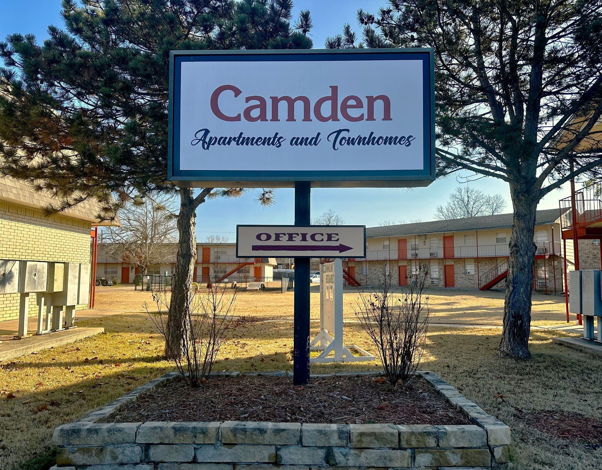Sign for Camden Apartments and Townhouses, with "Office" sign pointing right.