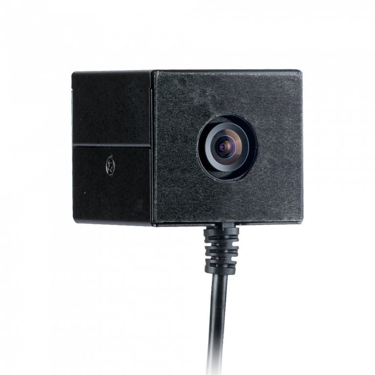 Covert camera with lens and attached cord.