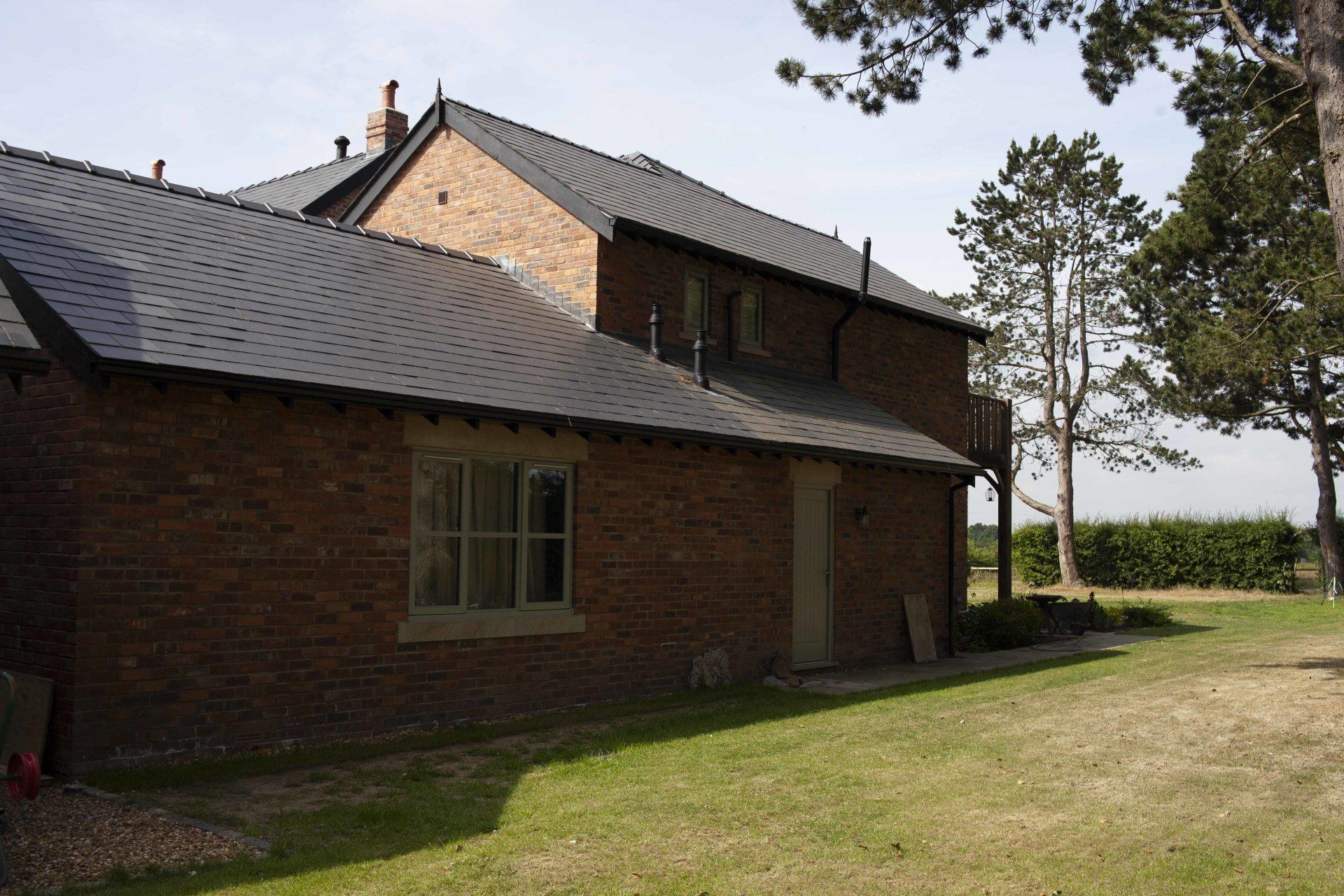 A large brick house with a slate roof