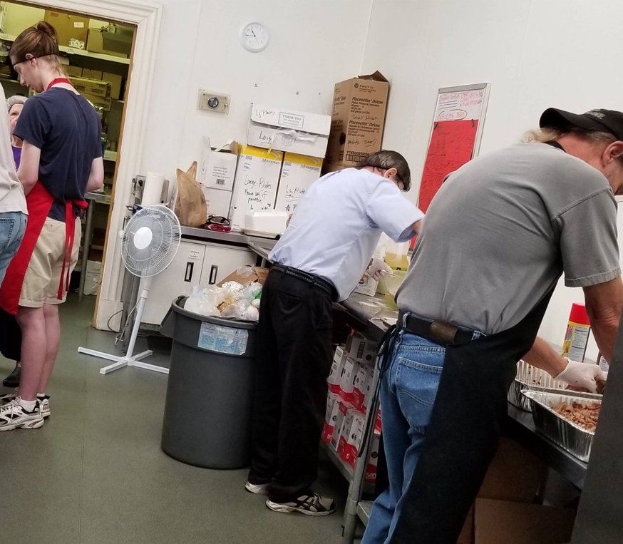 people cooking in the Weekend Lunch kitchen