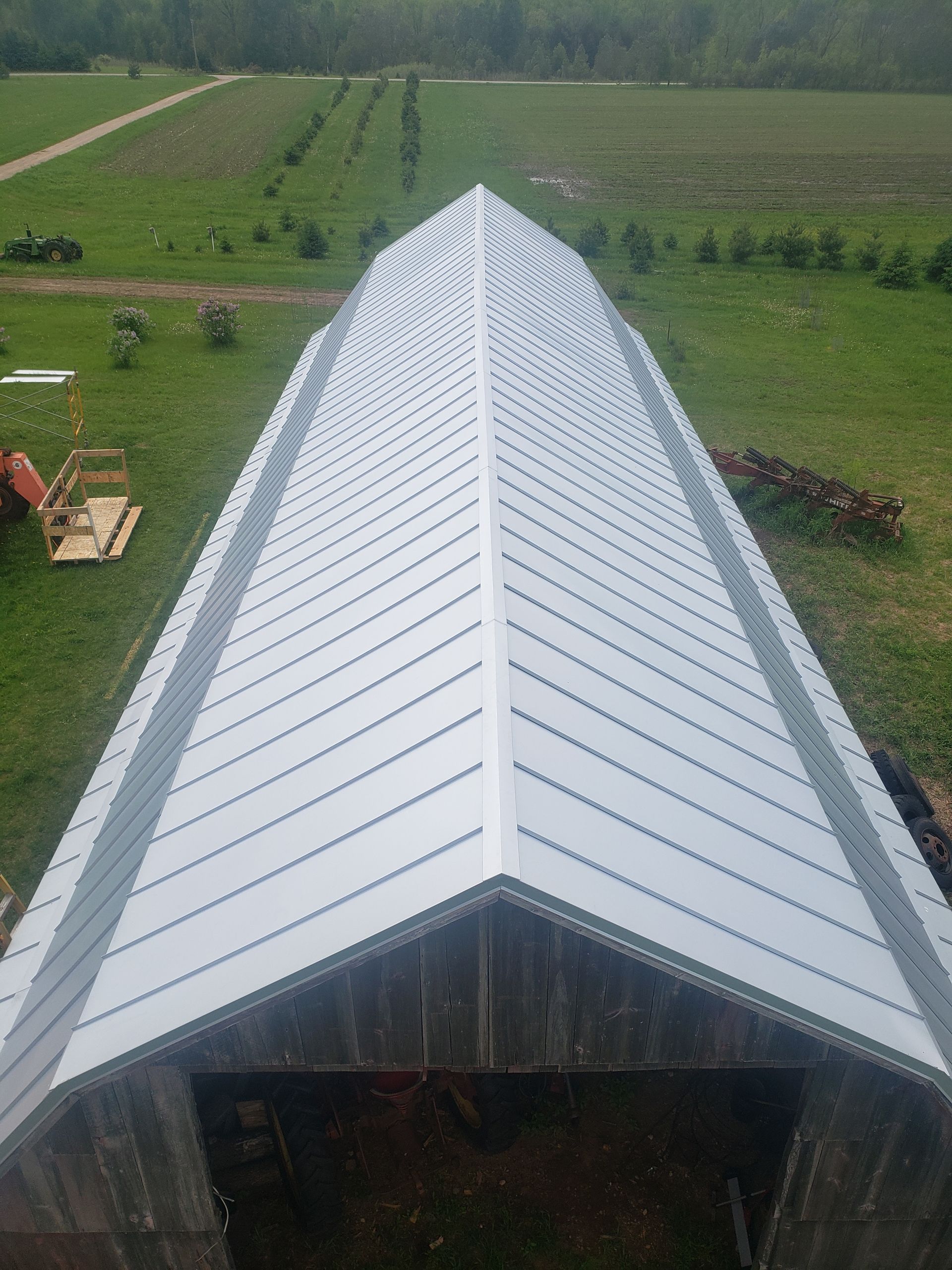 A house with a metal roof and a lot of windows
