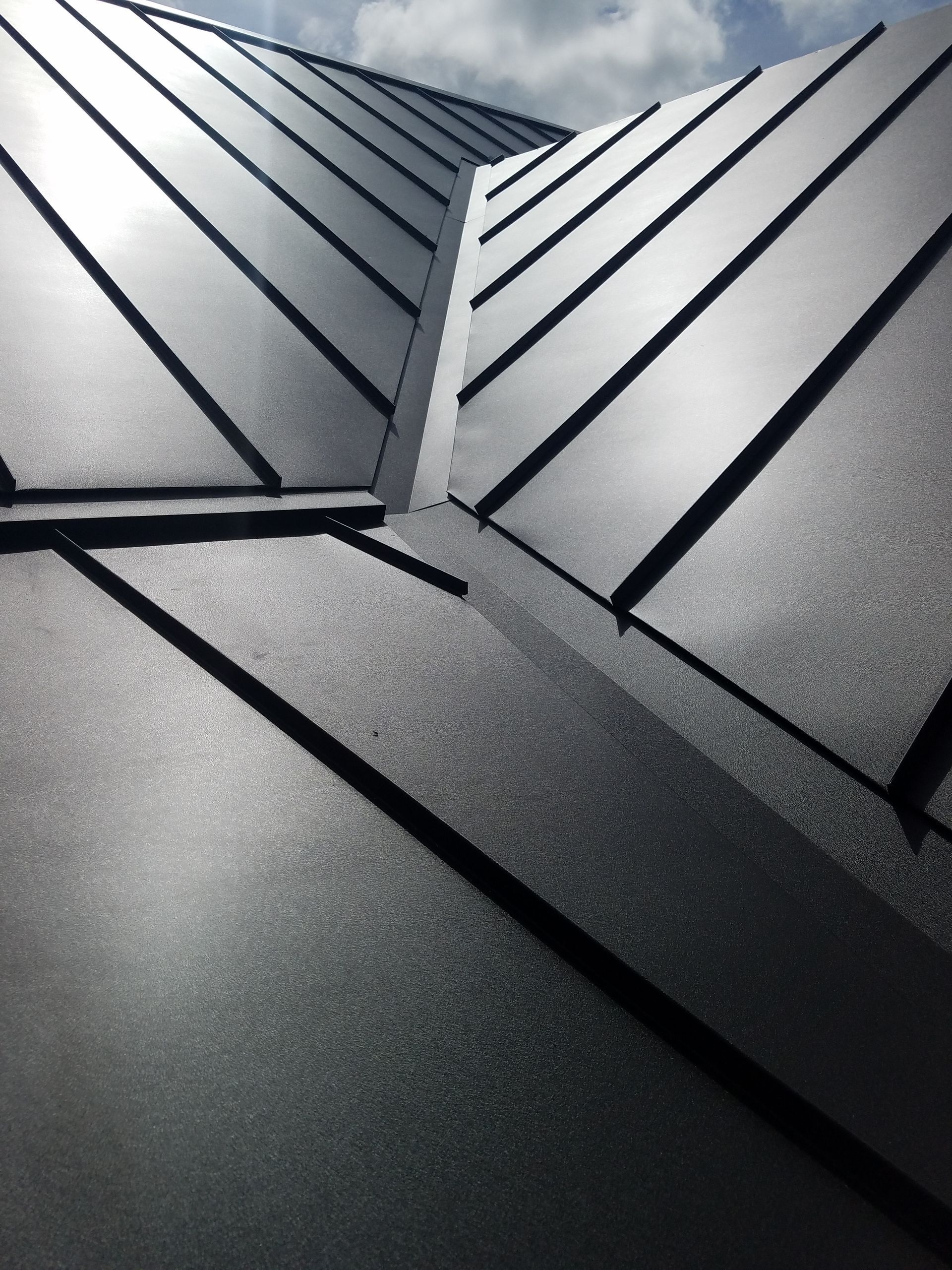 A close up of a black metal roof