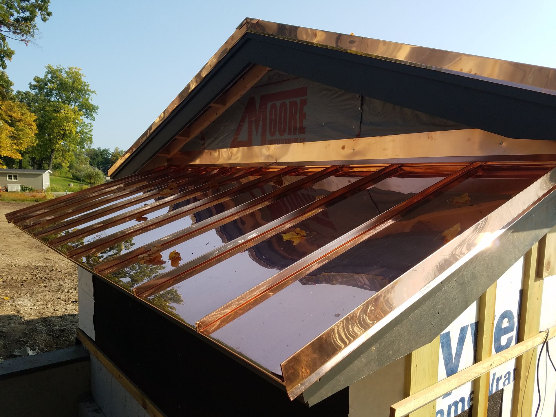 A copper roof is being installed on a building