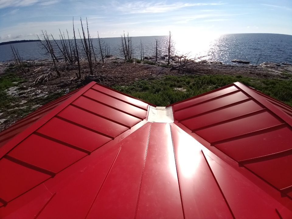 A red roof with a view of the ocean