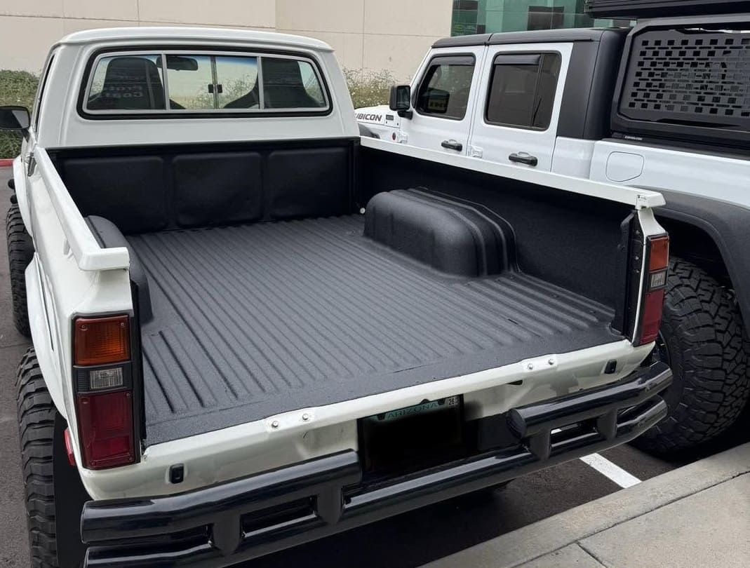 Spray-in bedliner applied to pickup truck bed