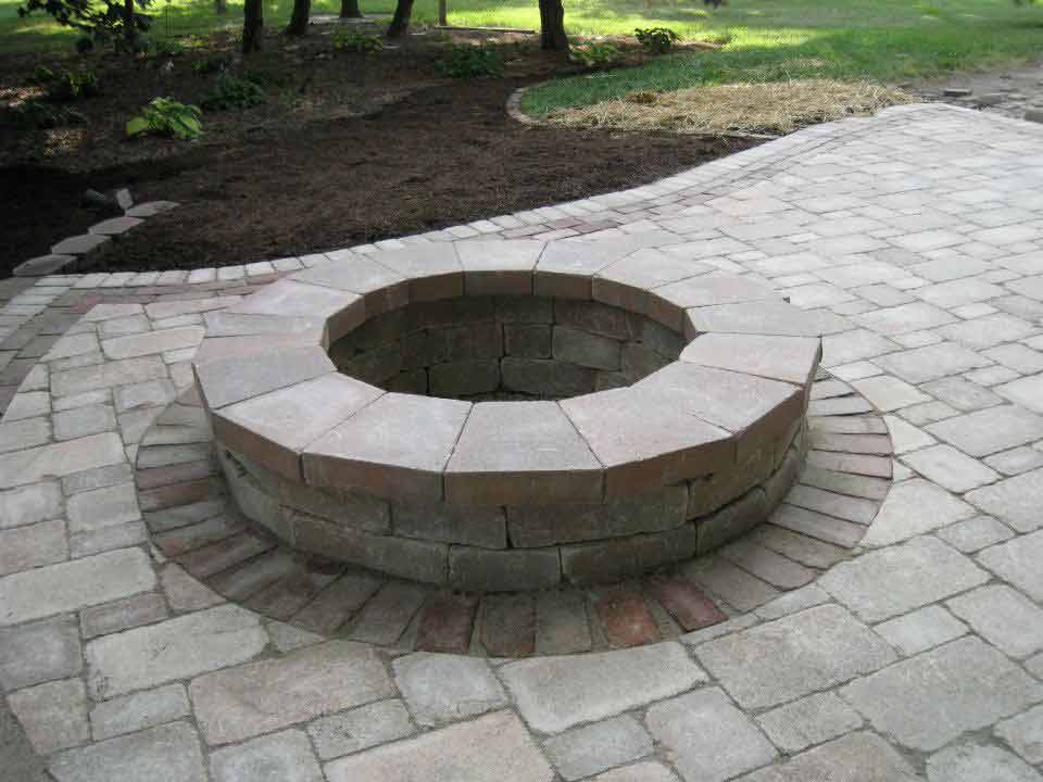 Nice landscape bricking patio with firepit installed around back of house in Mapleton, IL - Beal Landscaping