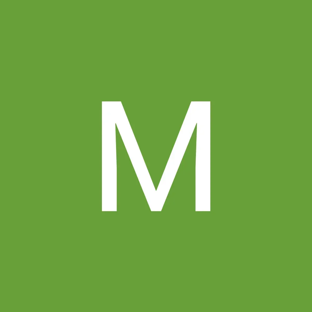 White letter M on a green background.