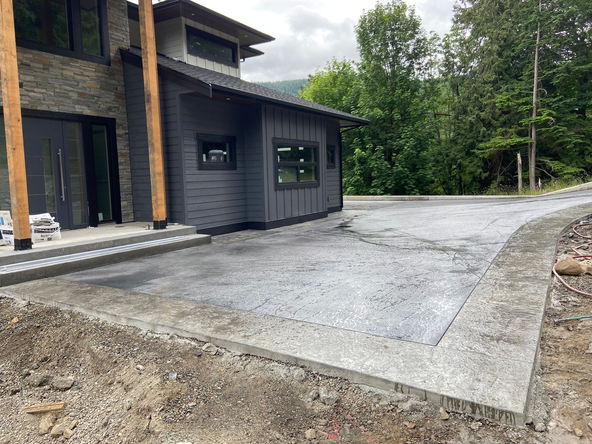 A large house with a concrete driveway in front of it.