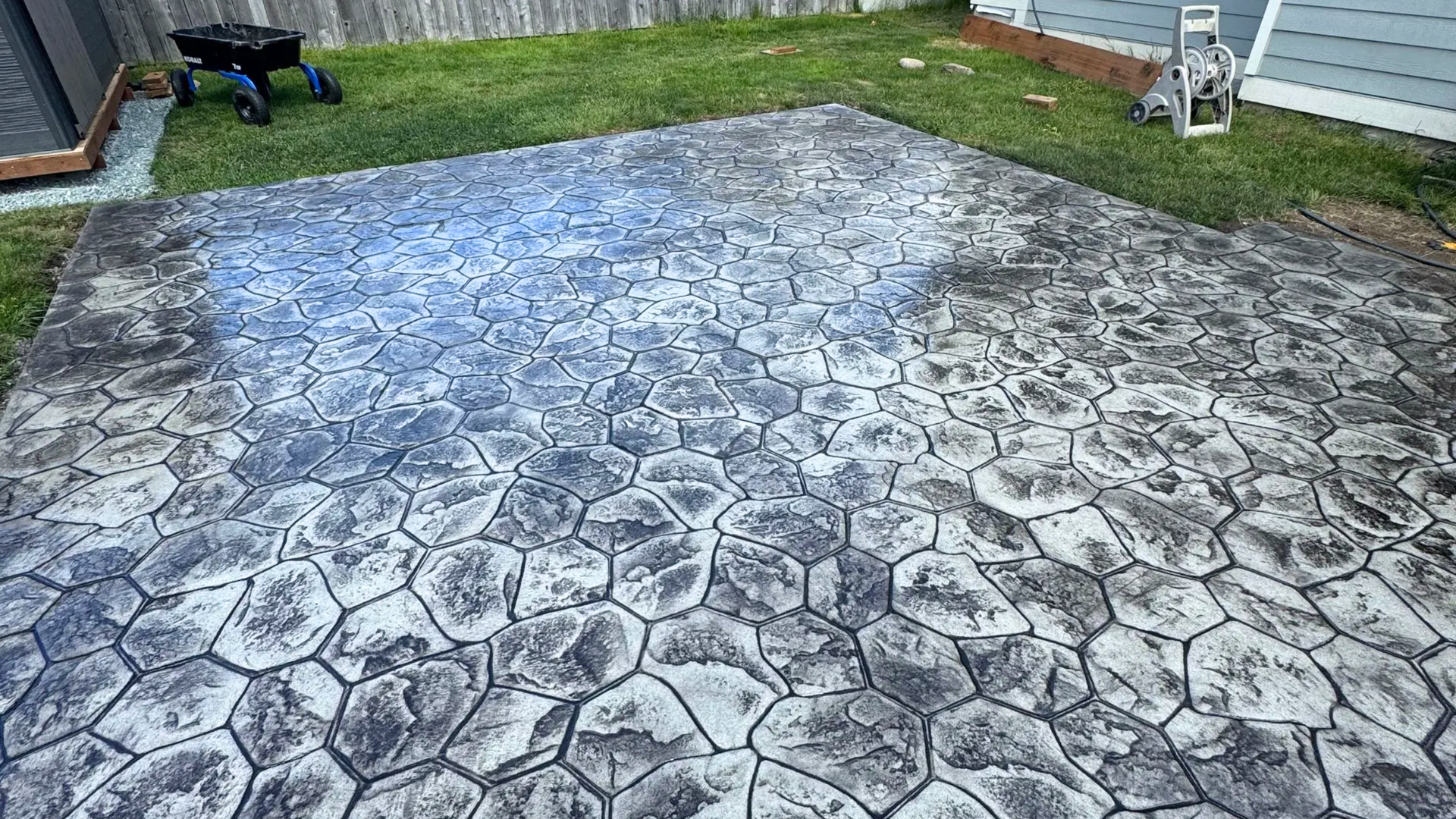 Close-up of stamped concrete patio with cobblestone pattern installed in Bellingham WA