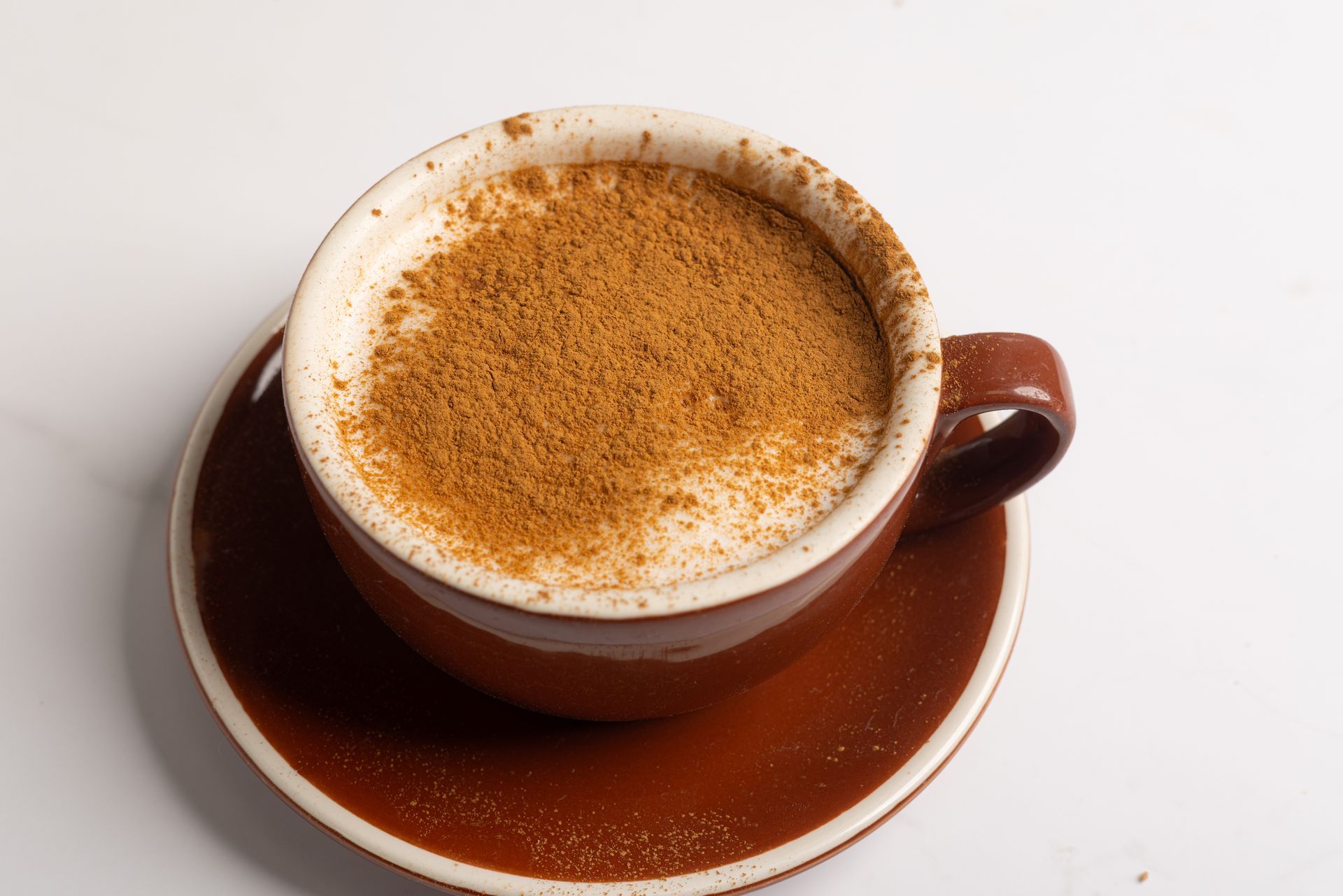 A cappuccino, dusted in cinnamin