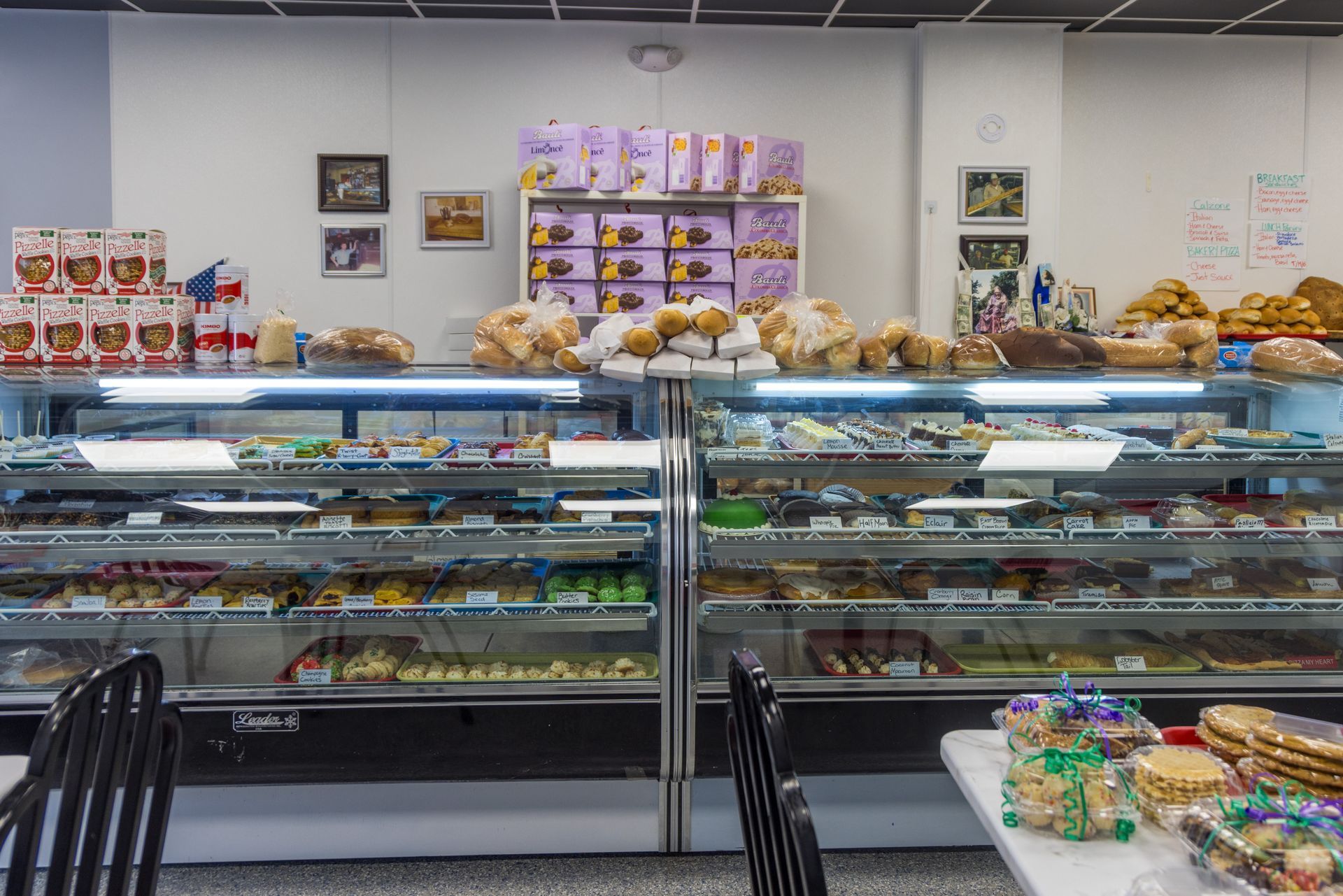 A glass case with fresh treats and desserts