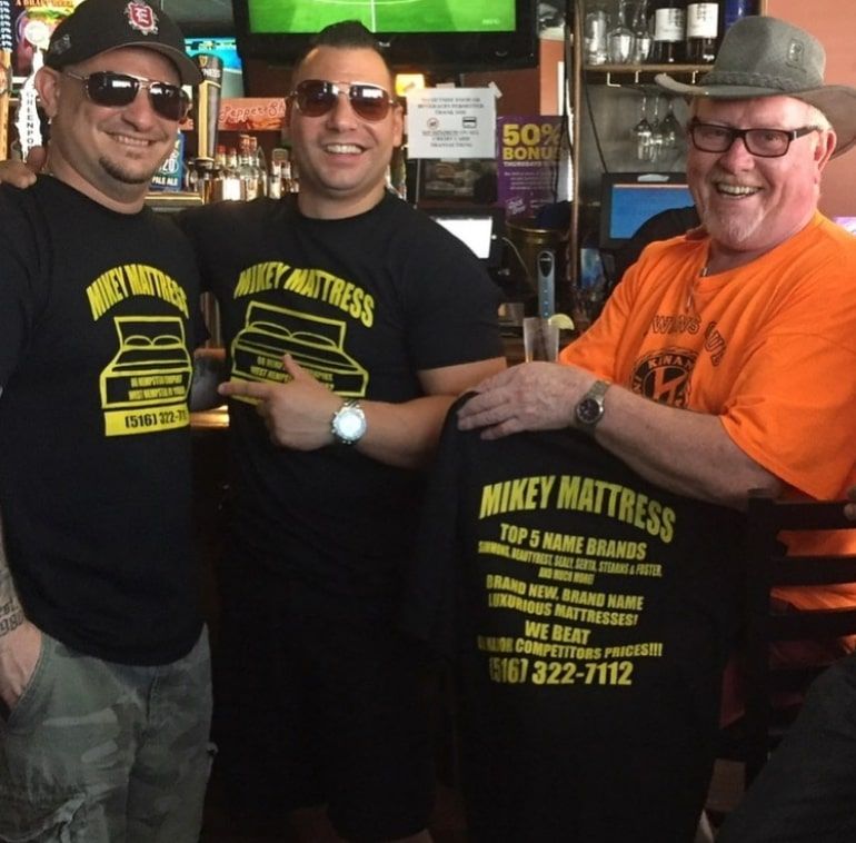 three men wearing shirts that say mikey mattress
