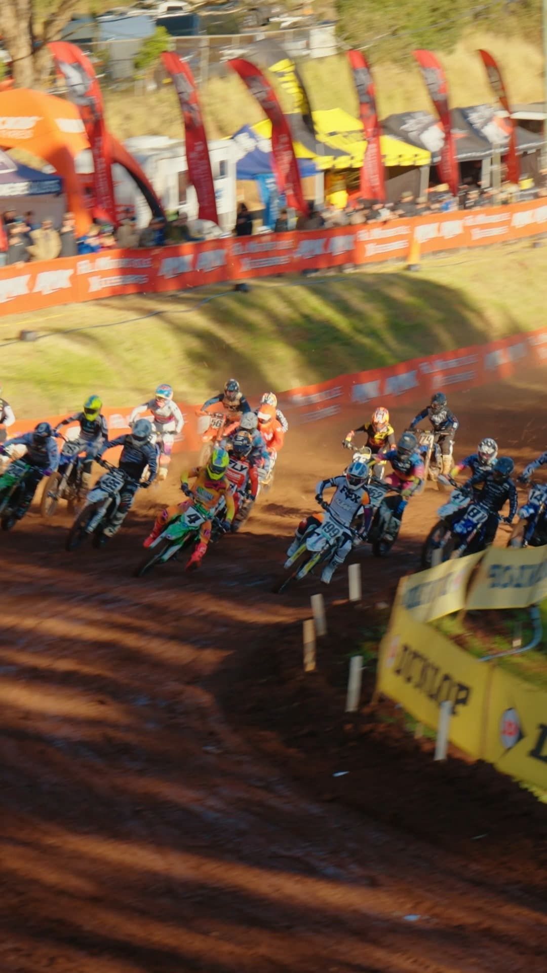 A Group of Dirt Bike Riders Are Racing on a Dirt Track — Mackay Kawasaki in North Mackay, QLD