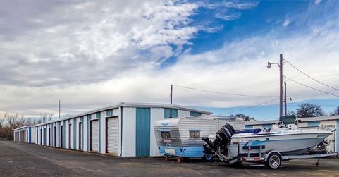 Self storage units with parked RVs and boats at Edmond RV & Self Storage in Edmond, Oklahoma
