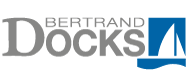 A logo for bertrand docks with a sailboat in the middle.